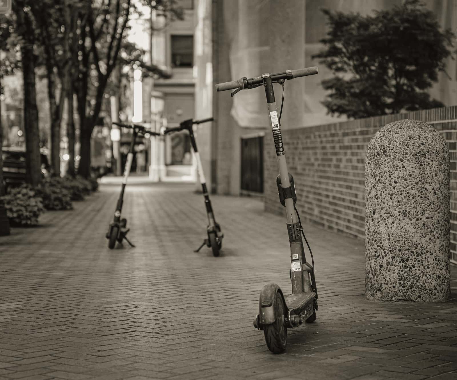 A sturdy electric scooter standing on urban pavement